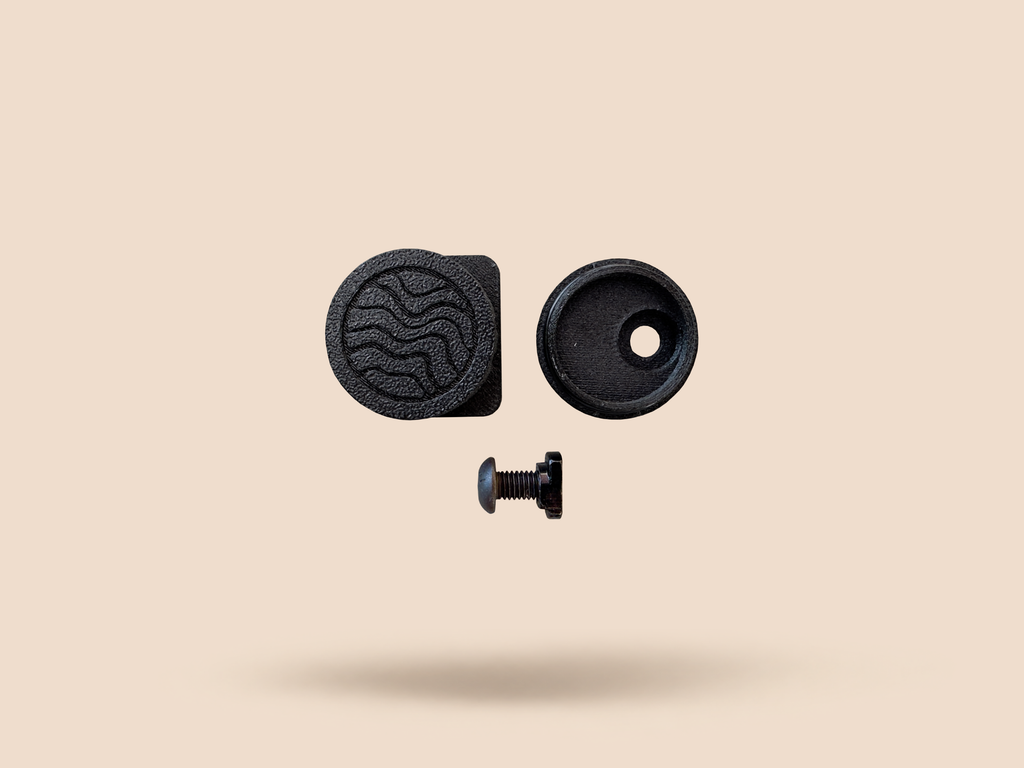 CHIP battery holder in Black, disassembled: logo cap, housing and mounting screw