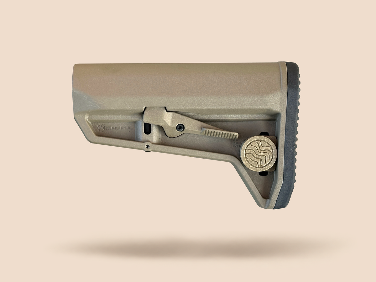 CHIP battery holder closed on a tan rifle stock, Terra Fieldworks logo cap facing out