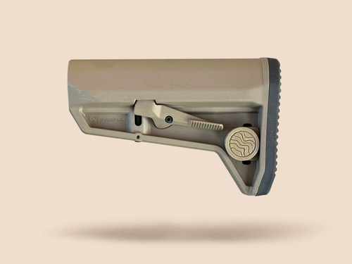 CHIP battery holder closed on a tan rifle stock, Terra Fieldworks logo cap facing out