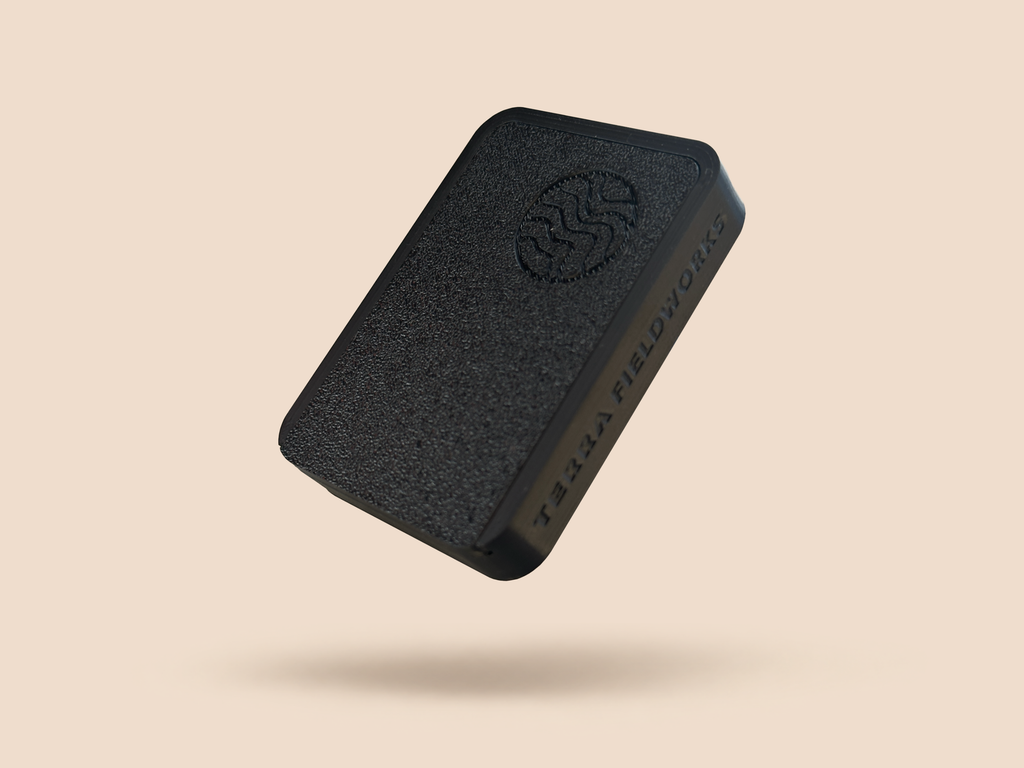 SIXSHOOTER magnetic pouch case in black, logo on the lid and Terra Fieldworks embossed on the side