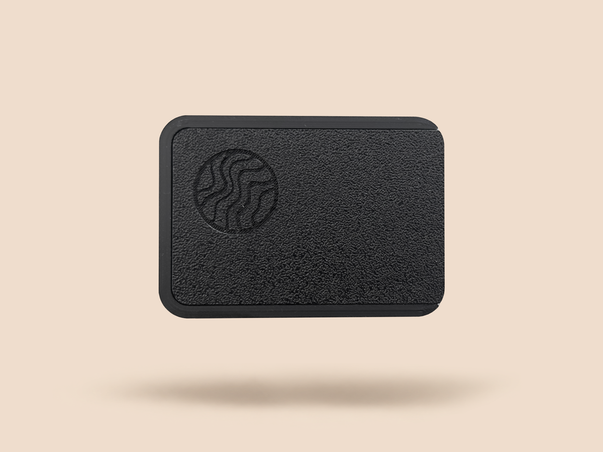 SIXSHOOTER magnetic pouch case closed, viewed from above with the embossed circular logo