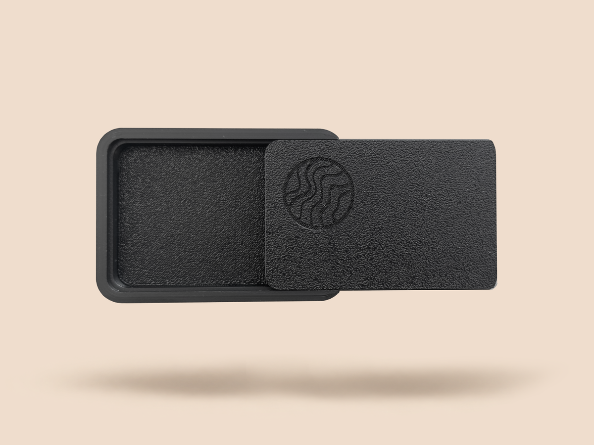 SIXSHOOTER case from above with the lid slid aside, revealing the empty textured tray