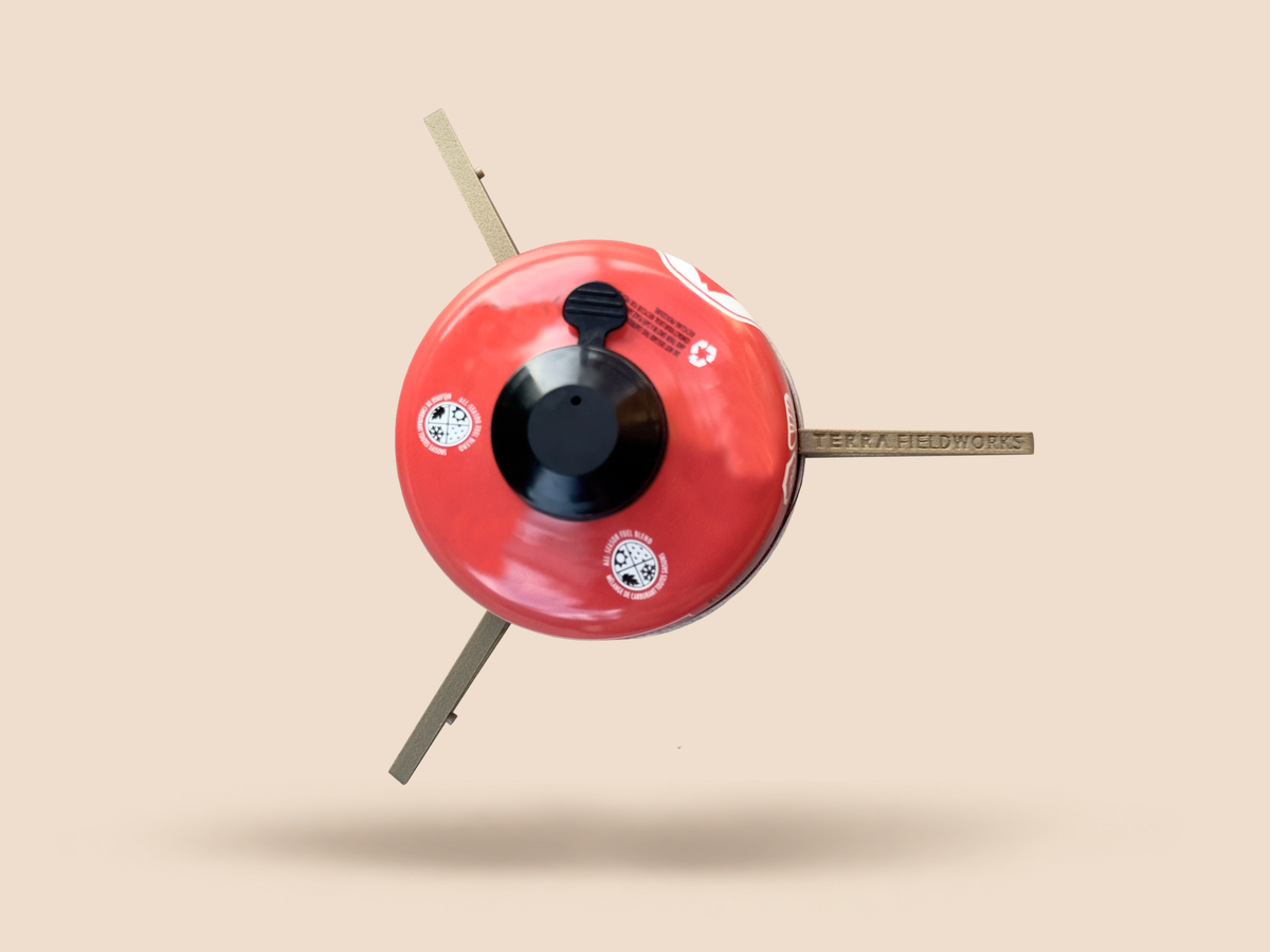 TALON ultralight magnetic legs clipped to a red fuel canister, overhead view